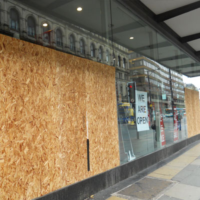 broken retail store front glass in austin